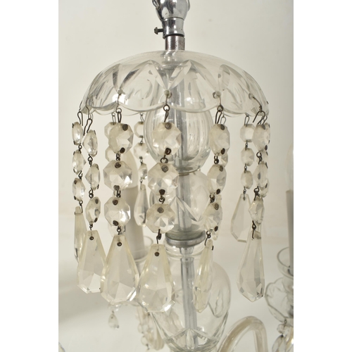 502 - A Bohemian Czech early 20th century circa 1910s moulded & cut clear glass five arm chandelier ce... 