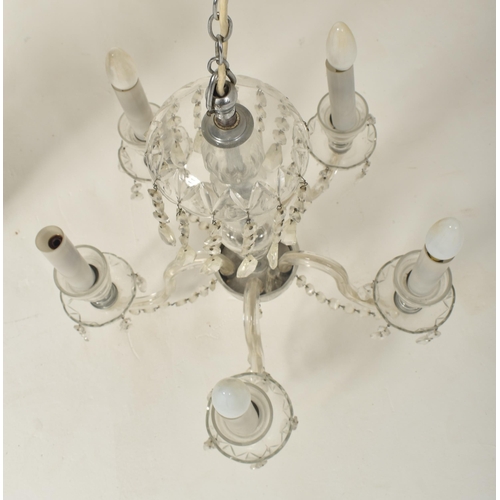 502 - A Bohemian Czech early 20th century circa 1910s moulded & cut clear glass five arm chandelier ce... 