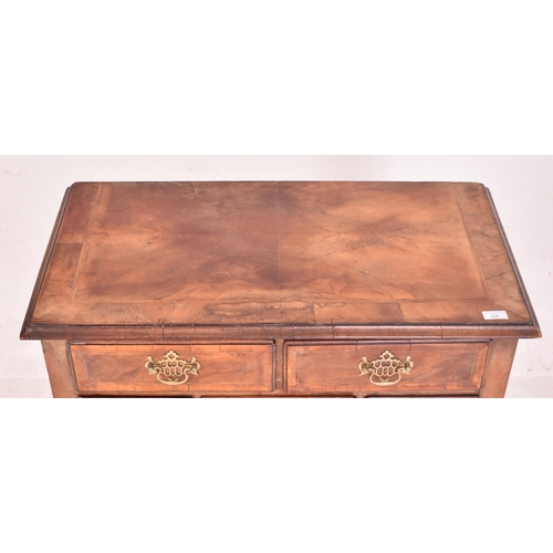 506 - An 18th century Queen Anne walnut and crossbanded, line inlaid lowboy kneehole desk. The lowboy with... 