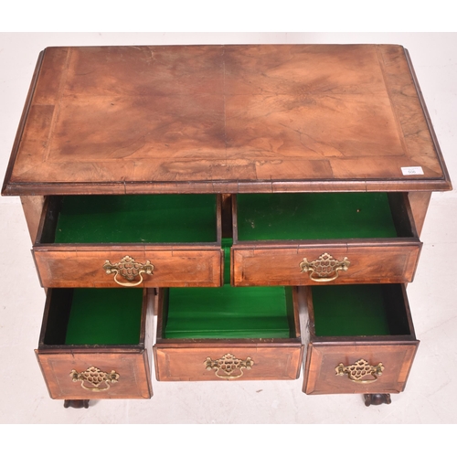 506 - An 18th century Queen Anne walnut and crossbanded, line inlaid lowboy kneehole desk. The lowboy with... 