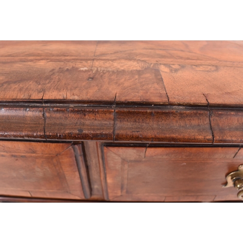 506 - An 18th century Queen Anne walnut and crossbanded, line inlaid lowboy kneehole desk. The lowboy with... 