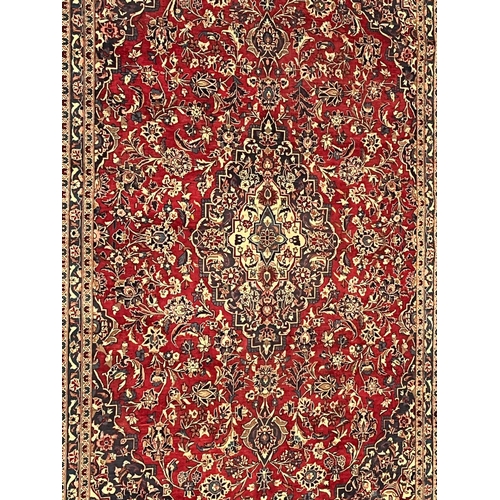 507 - A 20th century Central Persian Islamic Kashan floor carpet rug. The carpet having a central medallio... 