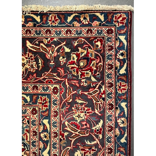 507 - A 20th century Central Persian Islamic Kashan floor carpet rug. The carpet having a central medallio... 