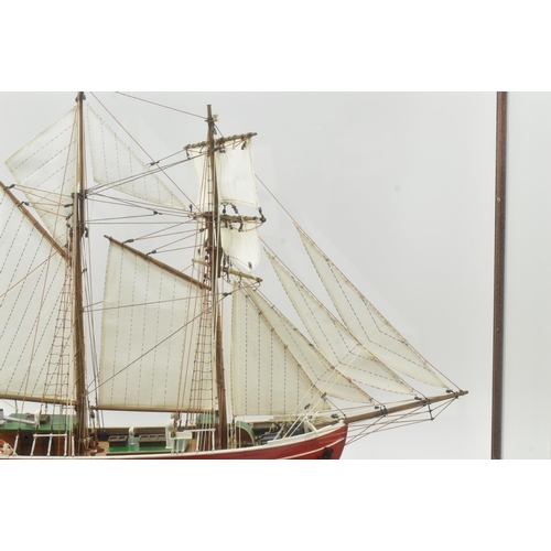 511 - An early 20th century hand built model sailing vessel - boat in glazed display cabinet. The boat pos... 