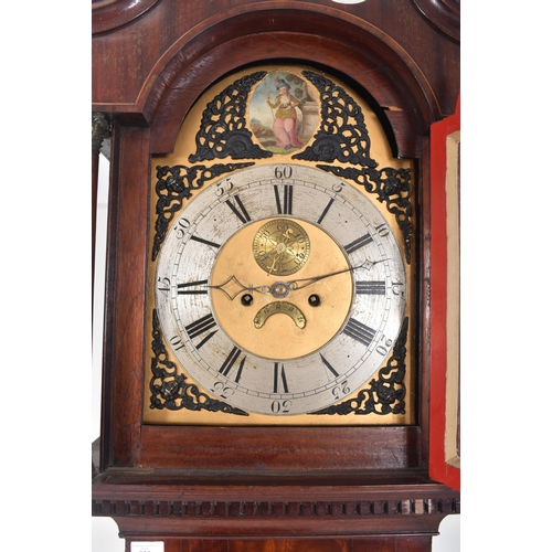 514 - A 19th century flame mahogany cased eight-day movement longcase clock. The clock having c-scrolled c... 