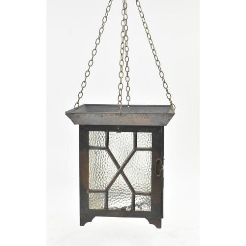 527 - An Arts & Crafts early 20th century copper toned metal and textured glass lantern porch hanging ... 