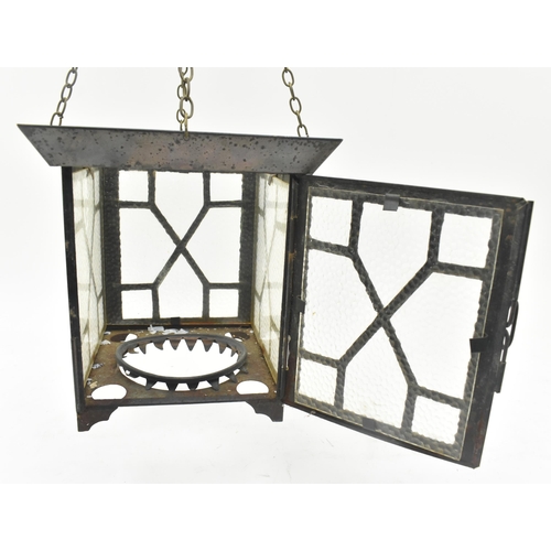 527 - An Arts & Crafts early 20th century copper toned metal and textured glass lantern porch hanging ... 