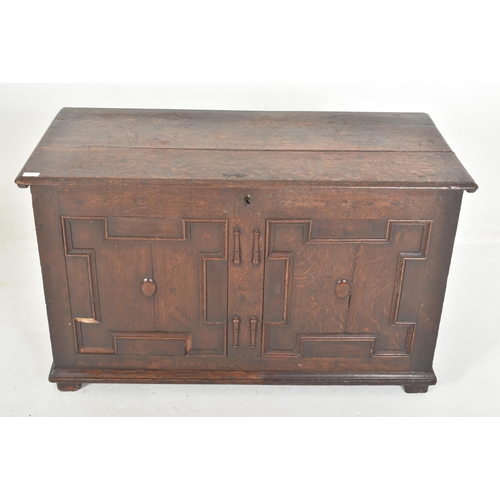 532 - An early 18th century carved oak block fronted coffer / blanket box chest. The coffer having a flare... 