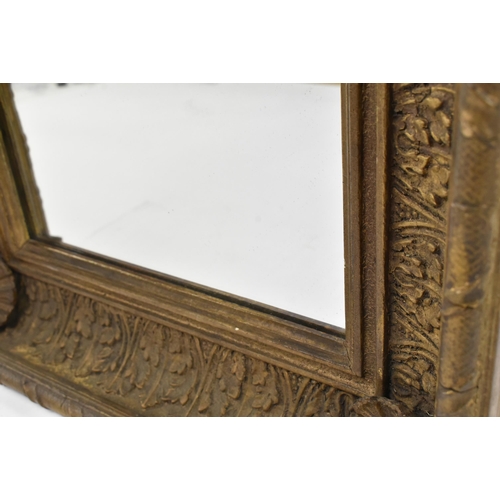 534 - A 19th century Victorian gilt and gesso cassetta hall mirror. The mirror of squared form having a ri... 