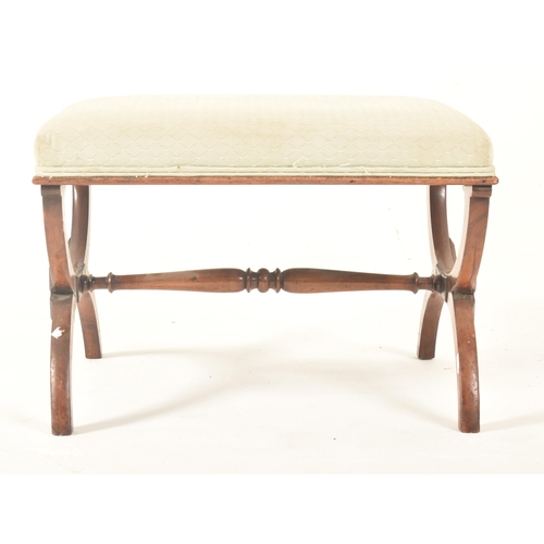 535 - A Regency early 19th century mahogany framed & upholstered X stool low window seat. The stool ha... 