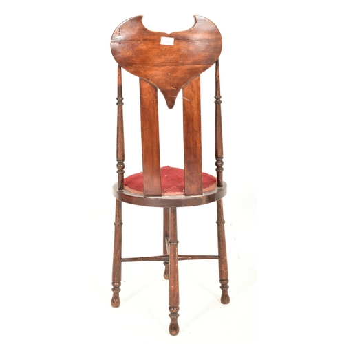 541 - An Arts & Crafts late 19th century mahogany & inlaid shaped chair in the manner of Liberty o... 