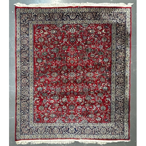 543 - A 20th century Islamic Sarouk Bakhtiyar floor carpet rug. The rug having a central red ground panel ... 