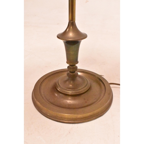 547 - An early 20th century Edwardian brass floor standard floor lamp. The lamp light featuring light blue... 