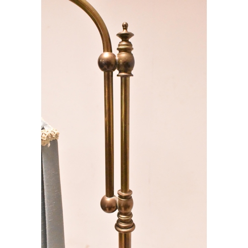 547 - An early 20th century Edwardian brass floor standard floor lamp. The lamp light featuring light blue... 