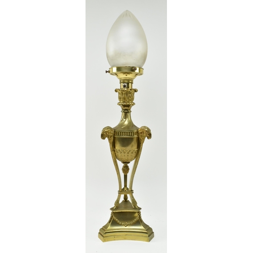 553 - A French Empire 19th century gilt metal & frosted glass ram heads desk table lamp light. The lam... 