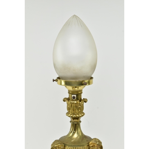 553 - A French Empire 19th century gilt metal & frosted glass ram heads desk table lamp light. The lam... 