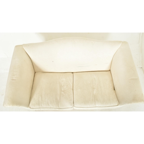 557 - A Victorian 19th century style upholstered camel hump back two seater sofa in the manner of Howard &... 