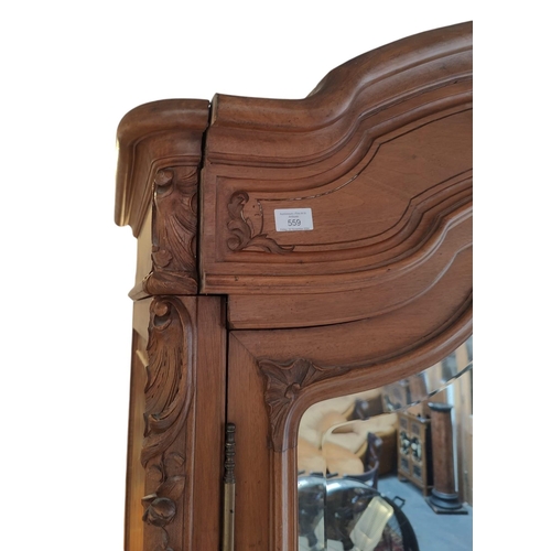 559 - A French 19th century Louis XV style kingwood mirror front armoire wardrobe. The wardrobe having a c... 