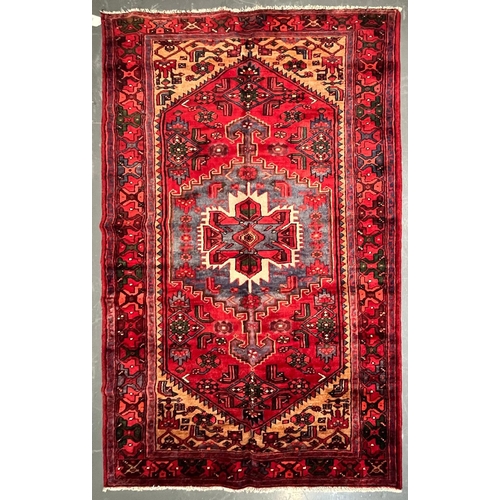 561 - An early 20th century North West Persian Islamic Zanjan floor carpet rug. The rug a series of centra... 