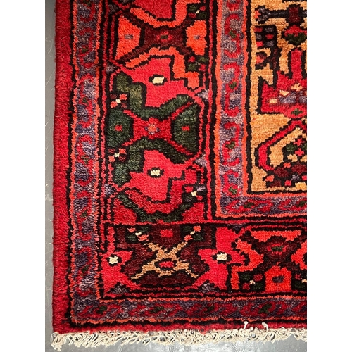 561 - An early 20th century North West Persian Islamic Zanjan floor carpet rug. The rug a series of centra... 