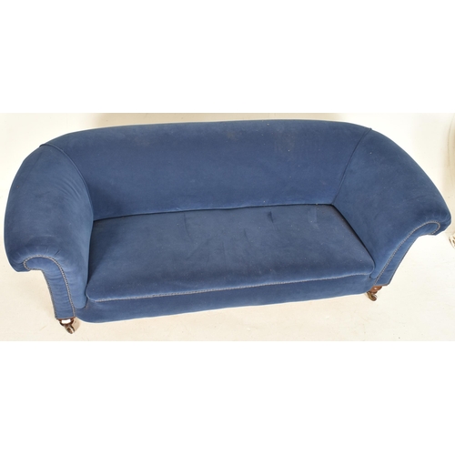 564 - A Victorian 19th century blue velvet upholstered Chesterfield seater sofa. The sofa raised on turned... 