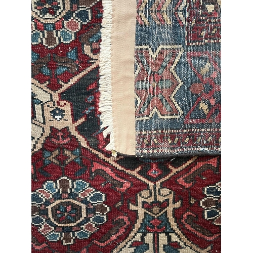 571 - An early 20th century Persian Islamic Bakhtiari hand woven floor carpet rug. The rug having a centra... 