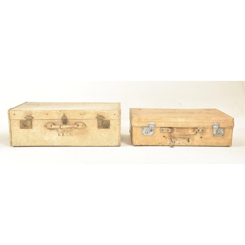 581 - A set of four early 20th century paper vellum style cream decorative travelling suitcases in varying... 