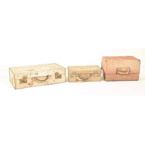 581 - A set of four early 20th century paper vellum style cream decorative travelling suitcases in varying... 