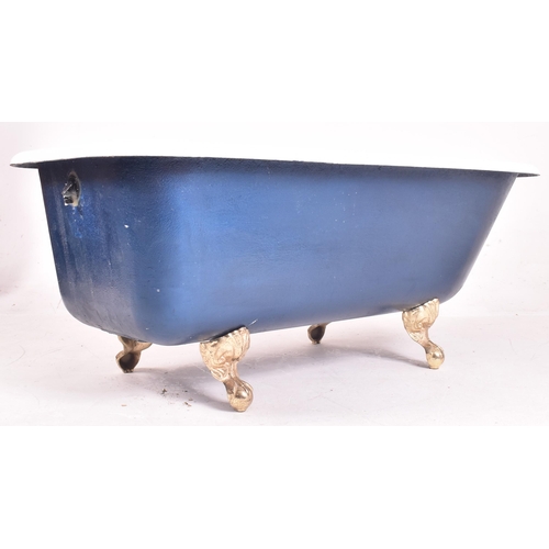 583 - A contemporary Victorian style roll top bath / bathtub. The tub of typical form having a white ename... 