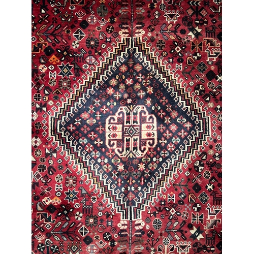 584 - An early 20th century South West Persian Islamic Qashgai floor carpet rug. The rug having a central ... 