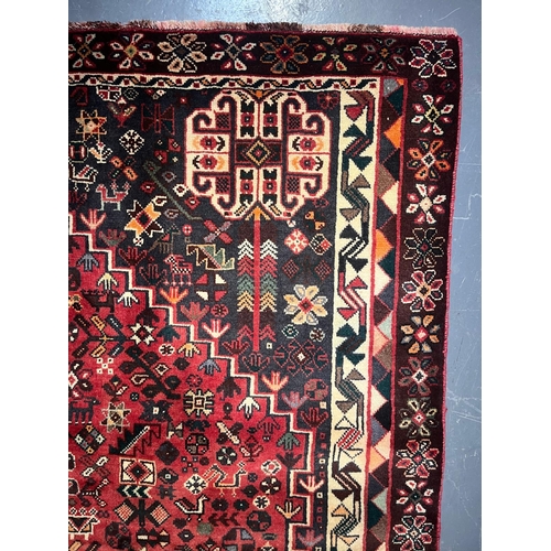 584 - An early 20th century South West Persian Islamic Qashgai floor carpet rug. The rug having a central ... 