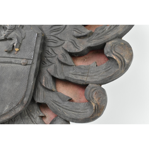 585 - A believed Spanish Iberic peninsula early 20th century carved wood Imperial eagles shield crest. The... 