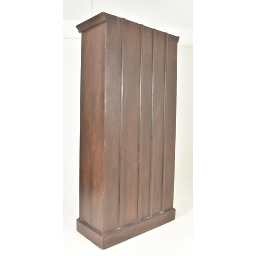 594 - A 19th century Indian stained teak housekeeper / kitchen cupboard. The cupboard having a two full le... 