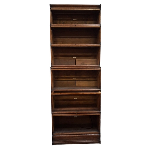 352 - Globe Wernicke, London - A large early 20th century oak six-tier sectioned barristers lawyers bookca... 