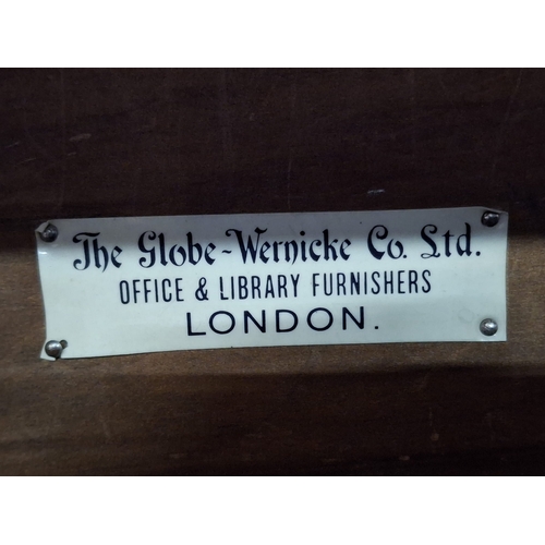 352 - Globe Wernicke, London - A large early 20th century oak six-tier sectioned barristers lawyers bookca... 