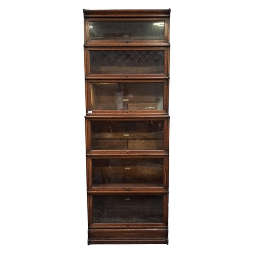 352 - Globe Wernicke, London - A large early 20th century oak six-tier sectioned barristers lawyers bookca... 