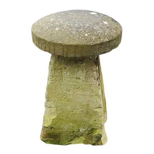 476 - An original 18th / 19th cenutry carved stone staddle stone base with a reconstituted stone top. The ... 