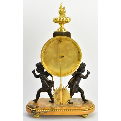 20 - A 19th century French Empire style mantle clock, along with two candlestick garnitures. The clock wi... 