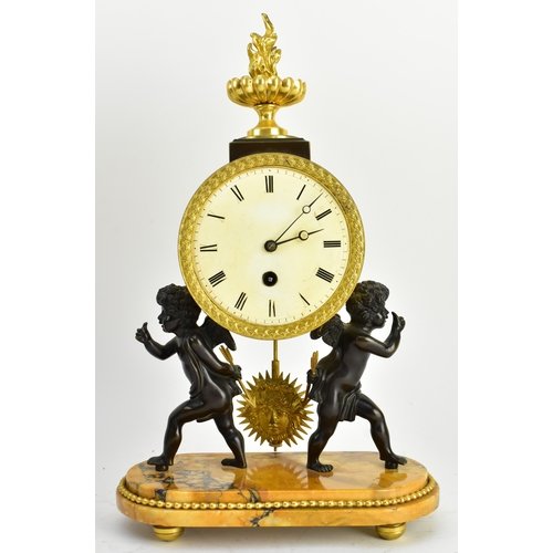 20 - A 19th century French Empire style mantle clock, along with two candlestick garnitures. The clock wi... 