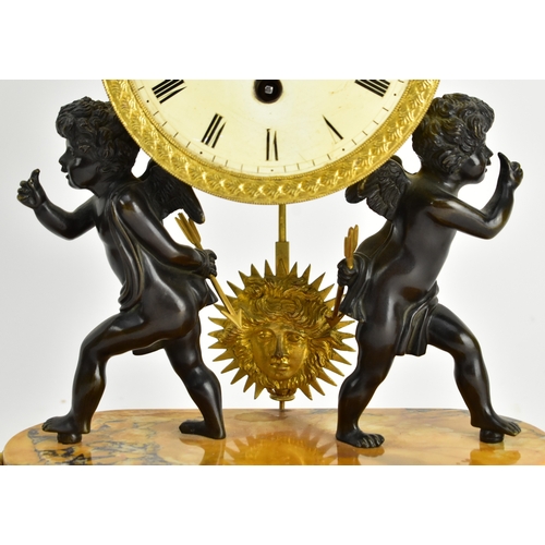 20 - A 19th century French Empire style mantle clock, along with two candlestick garnitures. The clock wi... 