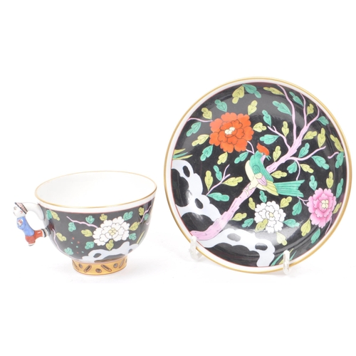 102 - Herend - A vintage 20th century Herend Macao pattern tea cup and saucer. The teacup and saucer havin... 