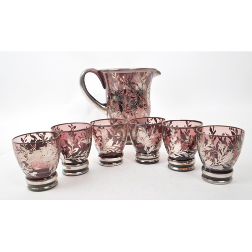 105 - A mid 20th century Italian Murano glass lenonade set. The set featuring a pitcher and six glasses. E... 