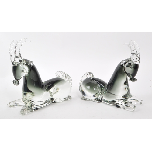 129 - A pair of mid-century Italian murano-style glass antelope sculptures, in a smoky blue colour. Each m... 