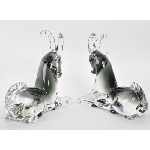 129 - A pair of mid-century Italian murano-style glass antelope sculptures, in a smoky blue colour. Each m... 