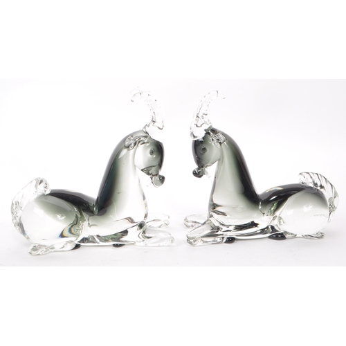 129 - A pair of mid-century Italian murano-style glass antelope sculptures, in a smoky blue colour. Each m... 