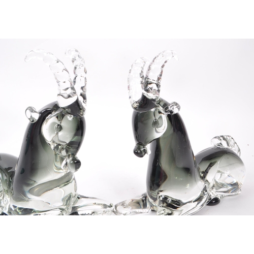 129 - A pair of mid-century Italian murano-style glass antelope sculptures, in a smoky blue colour. Each m... 