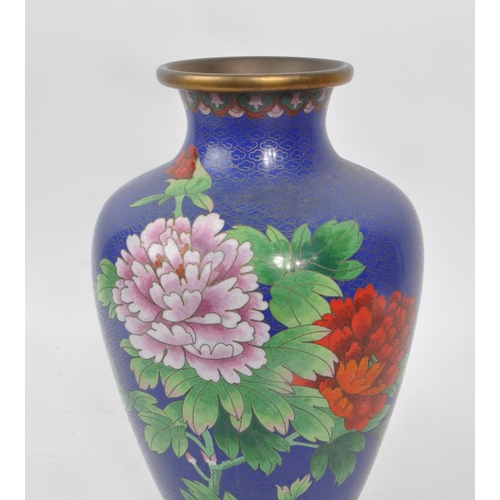 13 - A vintage 1920s blue enamel cloisonne vase, decorated to the main body with pink and red flowers and... 