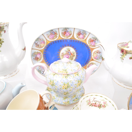 135 - A collection of vintage 20th-century fine bone china teapots, cups, and saucers. To include: Paragon... 