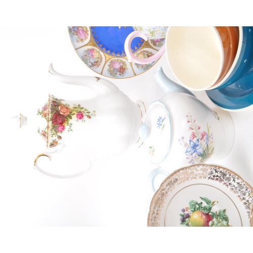 135 - A collection of vintage 20th-century fine bone china teapots, cups, and saucers. To include: Paragon... 