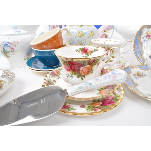 135 - A collection of vintage 20th-century fine bone china teapots, cups, and saucers. To include: Paragon... 